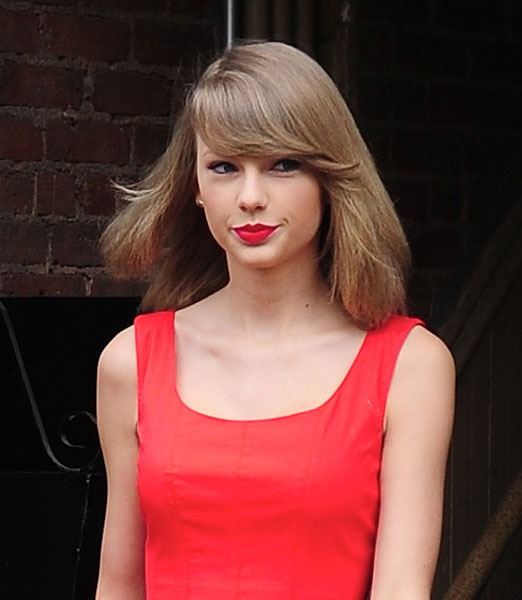 Taylor Swift Goes Back to Work With a Wink