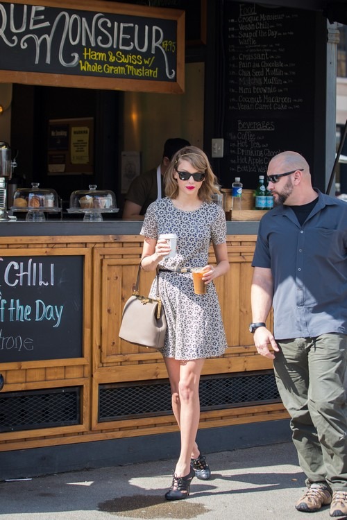 Taylor Swift and Cara Delevingne display their strikingly different styles as they reunite in the Big Apple for a spot of retail therapy