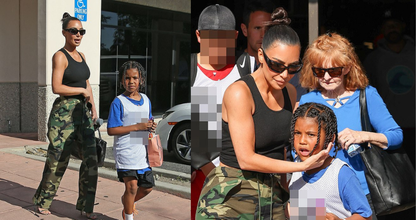 Kim Kardashian shows off her fit arms in a black tank top as she supports her son Saint at his basketball game