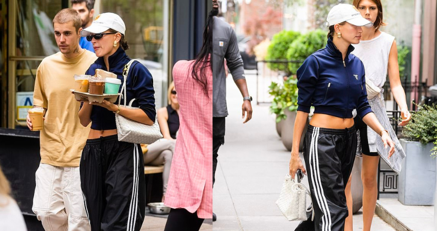 Hailey Bieber shows a glimpse of her toned abs in a cropped sports jacket with husband Justin Bieber as they enjoy a coffee date in NYC