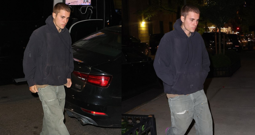 Justin Bieber looks casual cool in a black hoodie and fuchsia sneakers as he steps out in New York City