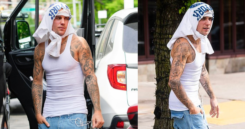 Justin Bieber wraps shirt around his HEAD as he showcases toned physique in clinging tank top in NYC