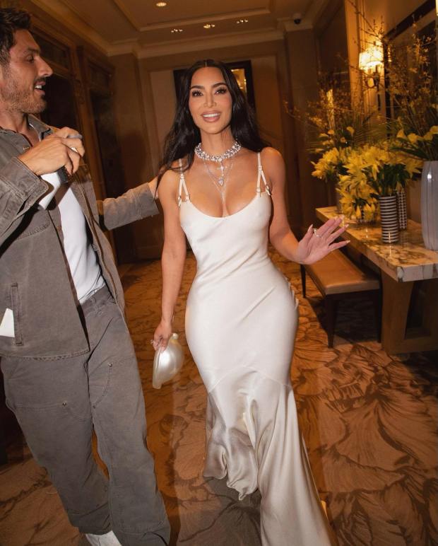 CLOSE CALL Kim Kardashian nearly suffers wardrobe malfunction in see-through white dress for new risqué pH๏τos inside dressing room