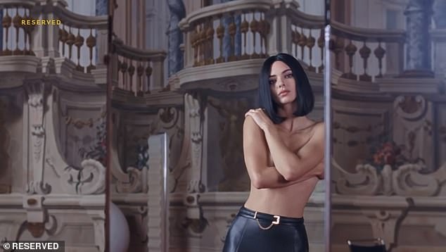 Kendall Jenner leaves little to the imagination as she goes topless in new Reversed campaign… while embracing her retro chic side with curly wig