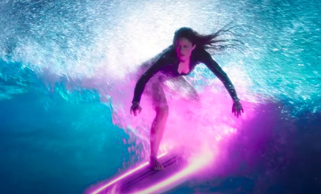 Shakira shows off her surfing skills again and gives a sneak peak of a new song