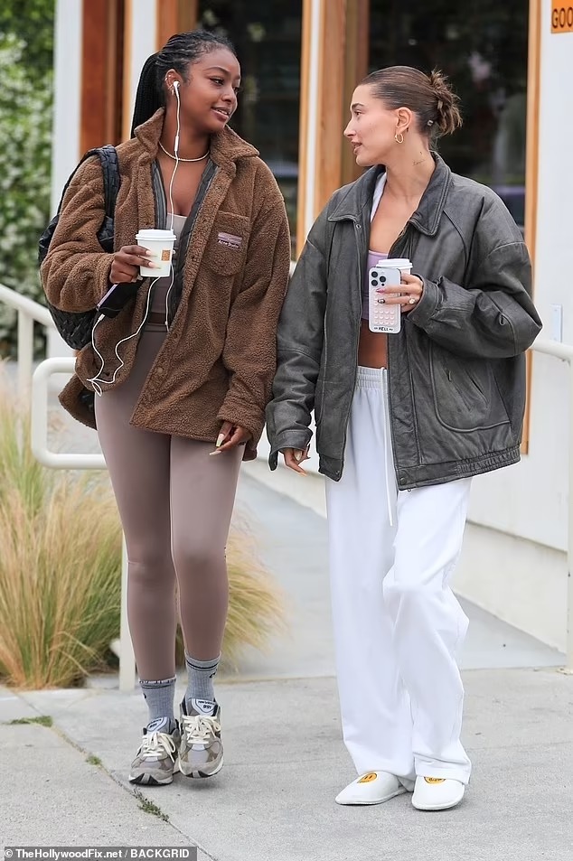 Justin’s wife – Hailey Bieber shows off her toned abs in a lavender bra top while joining best friend Justine Skye on a coffee run in West Hollywood