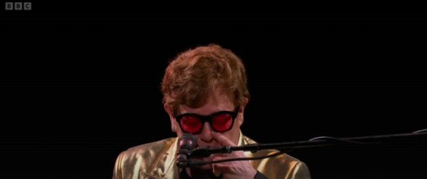 FITTING TRIBUTE Elton John wipes away tears as he pays emotional tribute to George Michael at Glastonbury