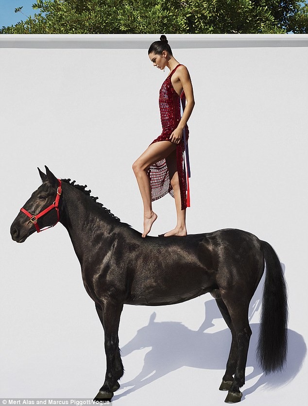 Not quite the cowgirl! Kendall Jenner STANDS on top of a horse for a strange new Vogue magazine pH๏τoshoot