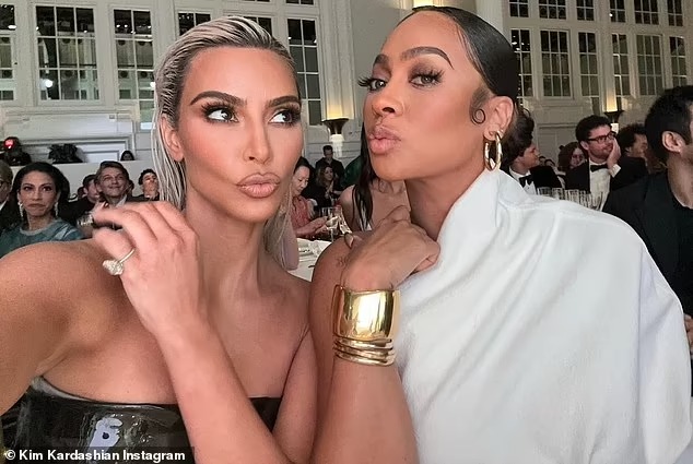 Kim Kardashian poses up at glamorous bash with best friend La La Anthony and cryptically declares: ‘If you see us happy just leave us alone please’