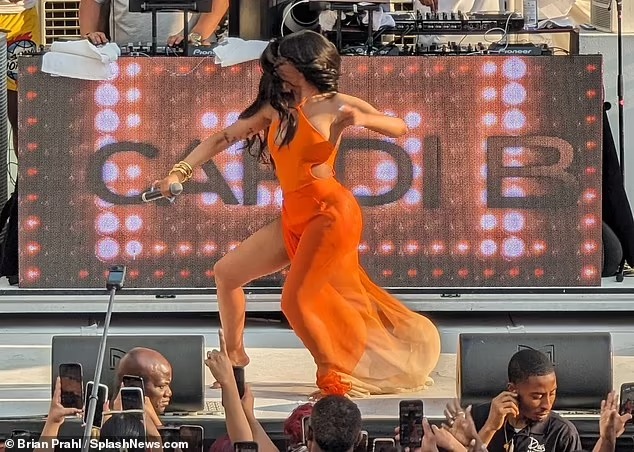 Cardi B hurls a microphone at a fan who threw a drink at her mid-performance… less than 24 hours after lobbing a mic at DJ in Las Vegas club