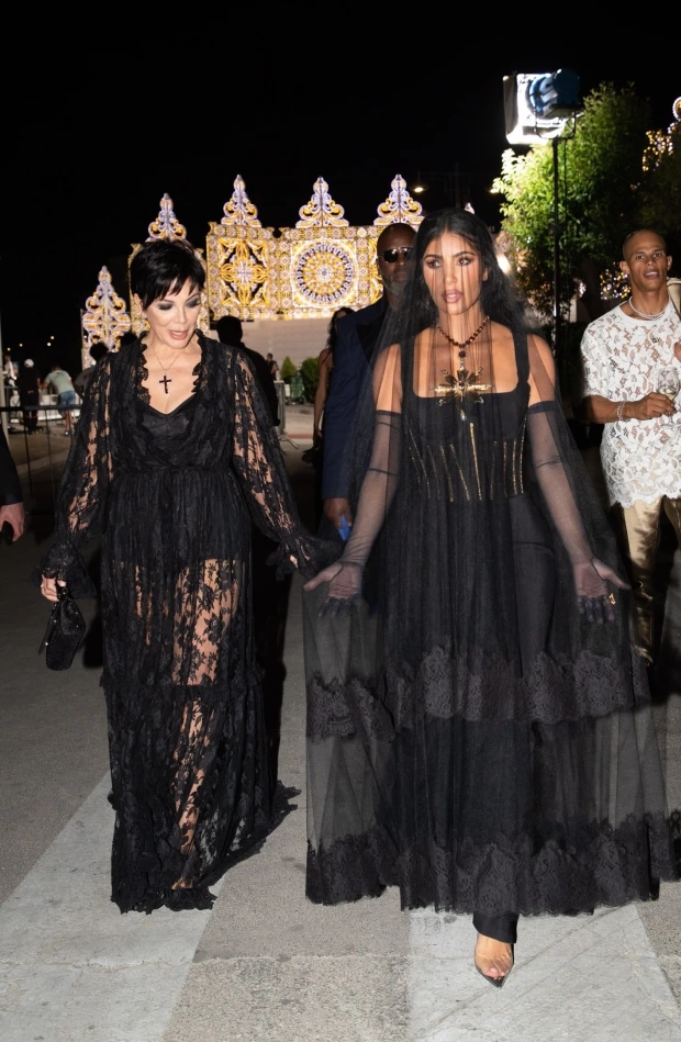 LOOKING HER BREAST Kim Kardashian almost busts out of skintight corset-style dress on night out in Italy with mom Kris Jenner