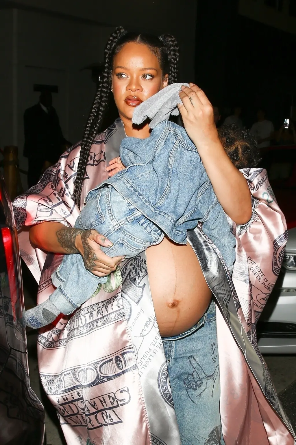 Pregnant Rihanna bares baby bump at dinner with son RZA