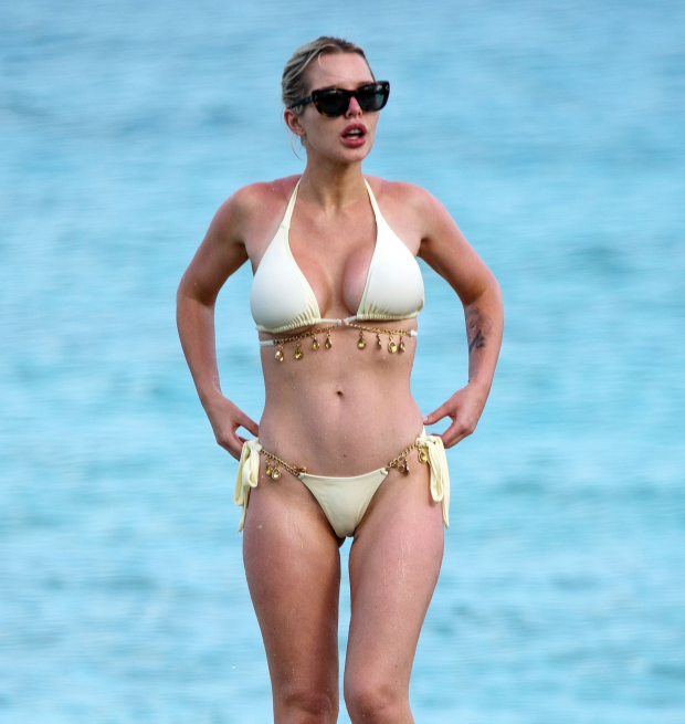 HEL YES Helen Flanagan shows off the results of secret boob job as she strips off to a white ʙικιɴι in Barbados