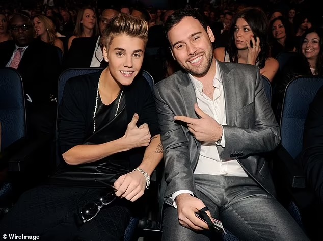 Revealed: Justin Bieber ‘hasn’t spoken to Scooter Braun in almost a year’ and is working on new album without him… despite being ‘still managed’ by music exec amid A-list exodus from his company