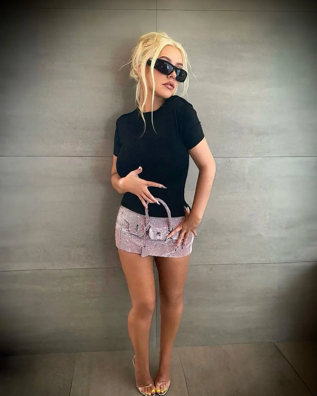 Christina Aguilera wears a blinged-out Birkin bag as a micro-miniskirt