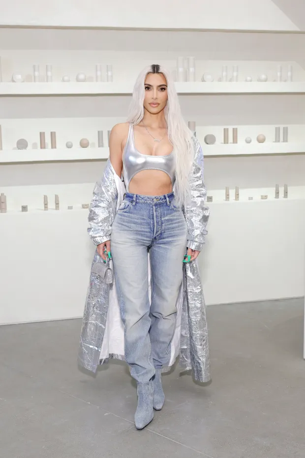 TWISTED SISTER Khloe Kardashian’s pin-thin waist drowns in white sweatpants as she steals sister Kim’s trademark look