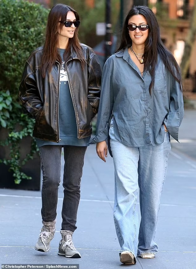 Emily Ratajkowski models a leather jacket as she walks her dog Colombo in NYC before meeting up with her best friend Babs Jeanne