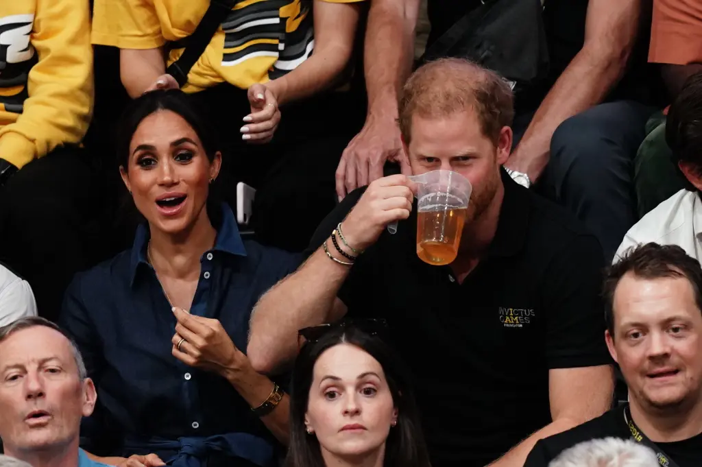 Prince Harry and Meghan Markle drink more beer at Invictus Games after boozy night out for his birthday