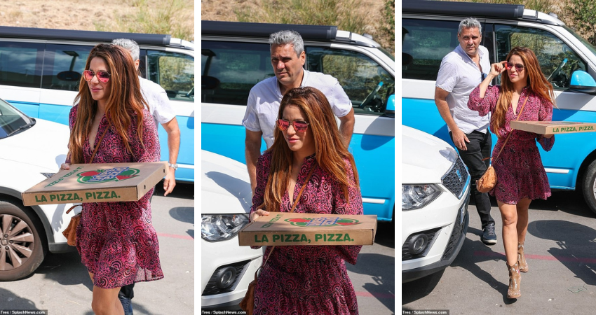 Shakira manages to put on a brave face as she picks up a pizza in Madrid