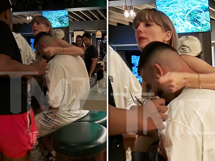 TAYLOR SWIFT WRAPS ARM AROUND TRAVIS KELCE During Postgame Party