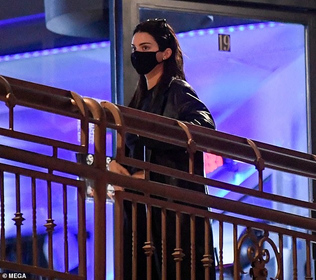 Kendall Jenner dons edgy leather coat and face mask as she steps out for sushi with friends – before going horseback riding