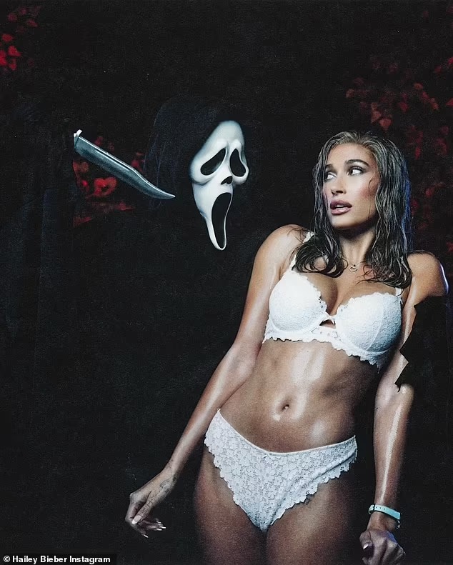 Hailey Bieber strips down to her underwear for Halloween costume as Carmen Electra in iconic Scary Movie sprinkler opening scene