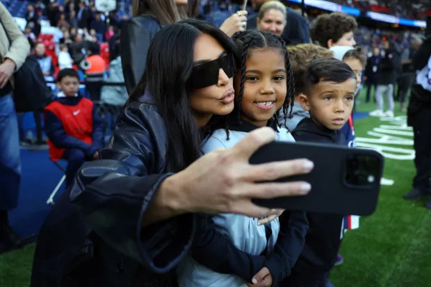 MONEY TALKS Kim Kardashian slammed for her ‘ulterior motives’ for trip with son Saint, 7, as fans claim it was ‘all about business’