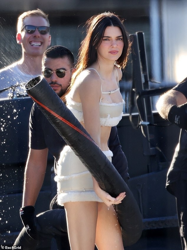 Kendall Jenner makes it snow in LA while clad in a $4K JACQUEMUS top and mini-skirt for holiday campaign