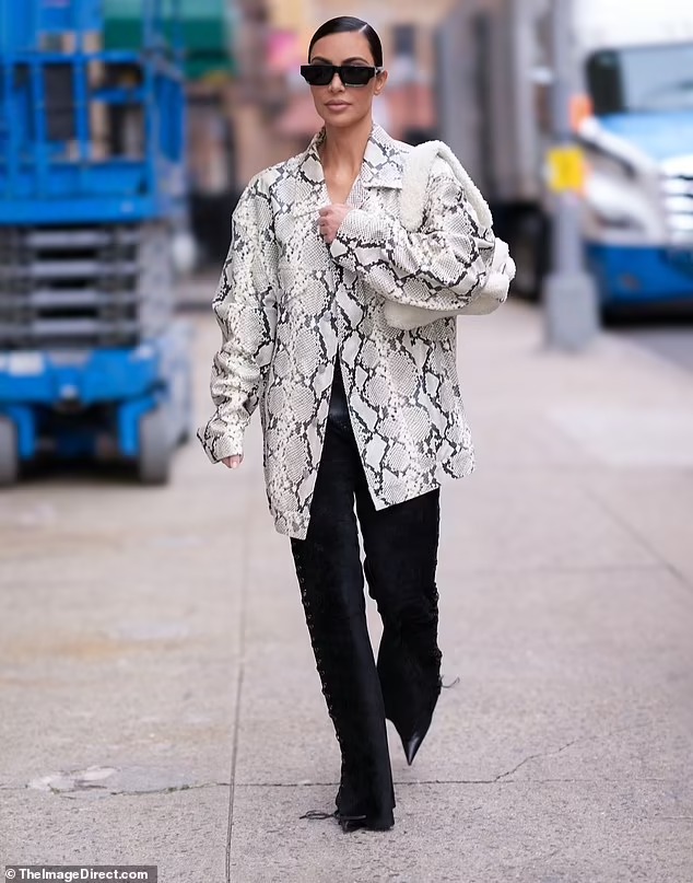 Kim Kardashian looks chic in snake skin-print jacket as she arrives on American Horror Story set in New York City