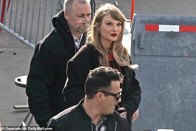 Taylor Swift consoles dejected boyfriend Travis Kelce as they hold hands while leaving Kansas City stadium on golf cart after Chiefs’ controversial loss to Bills in dying moments of nail-biting game