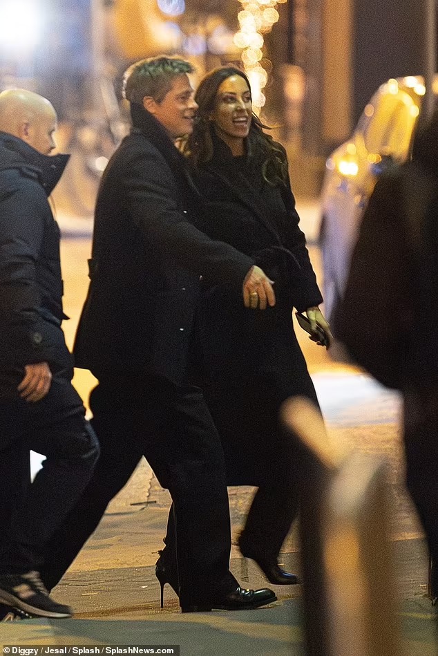 Brad Pitt looks very loved-up with his girlfriend Ines de Ramon, 33, as they make cosy appearance in Paris on his milestone 60th birthday