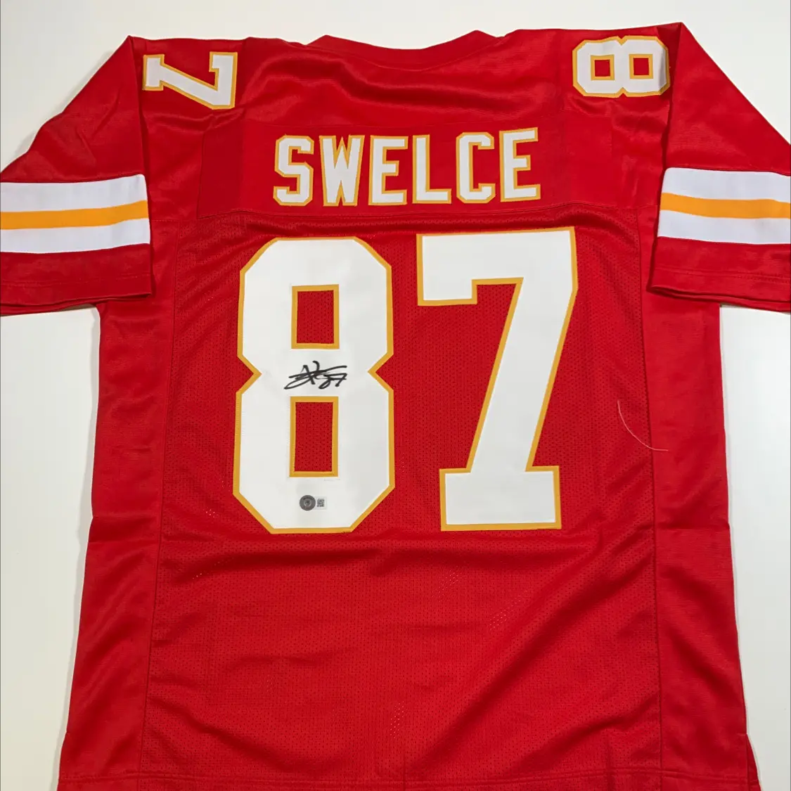 Travis Kelce signs custom ‘Swelce’ jersey for Kansas City Chiefs auction amid Taylor Swift romance