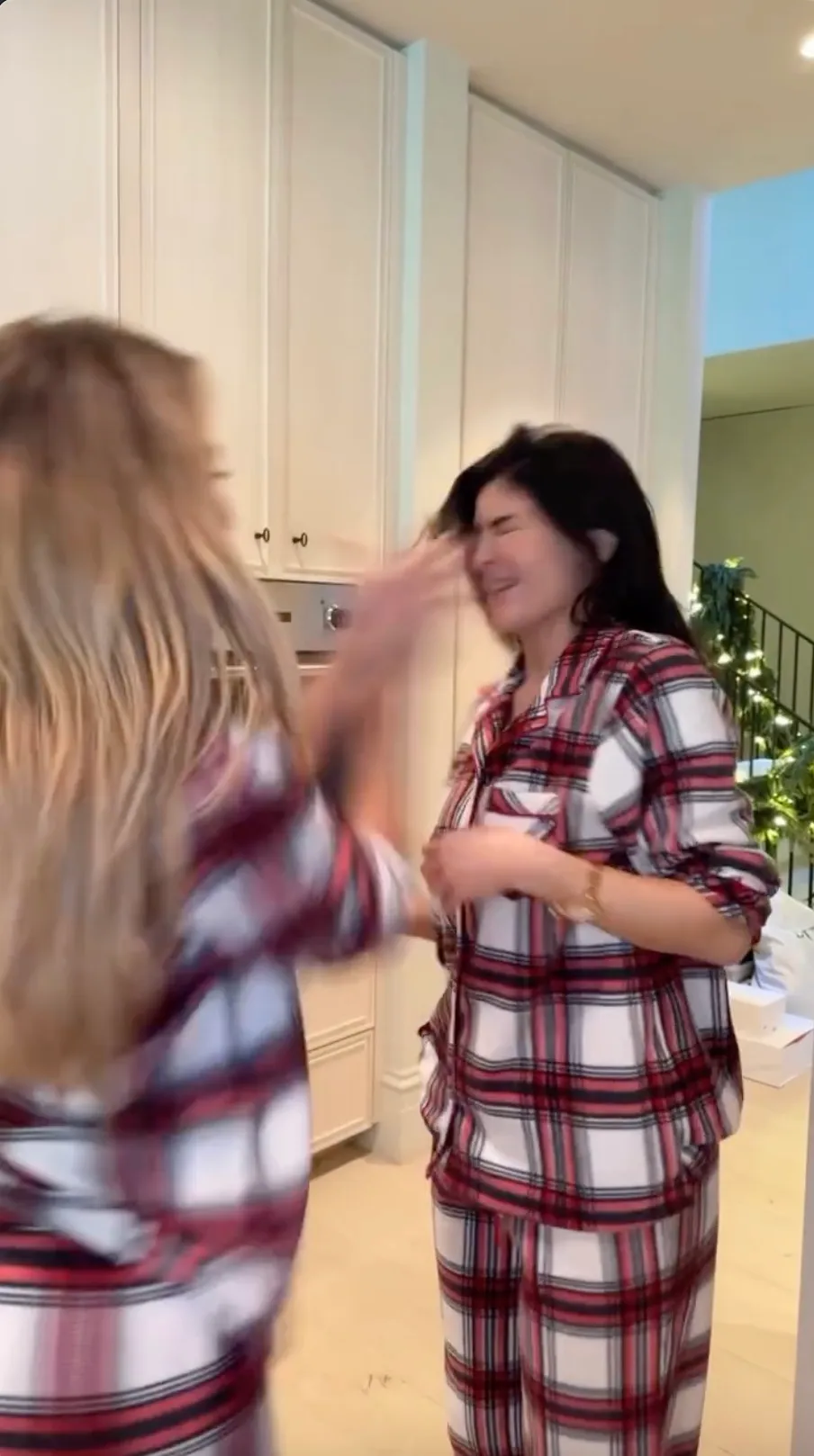 HOLIDAY HORROR Khloe Kardashian slaps sister Kylie Jenner across the face and calls her jaw-dropping name at home in Christmas pajamas