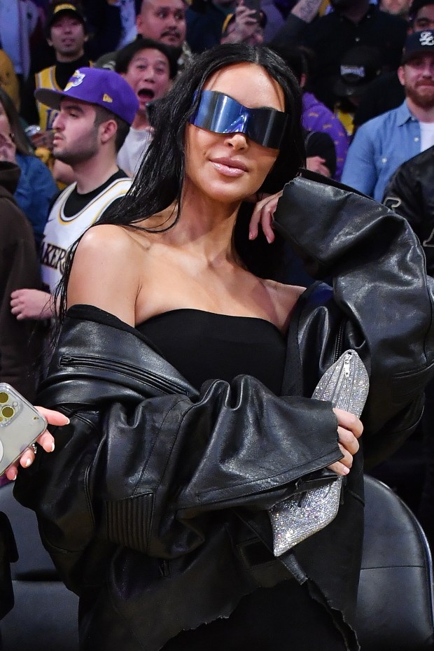 EYE SEE IT Kim Kardashian critics catch her ‘trying to hide’ her ‘wonky’ eye at game after sparking concern with ‘droopy’ features