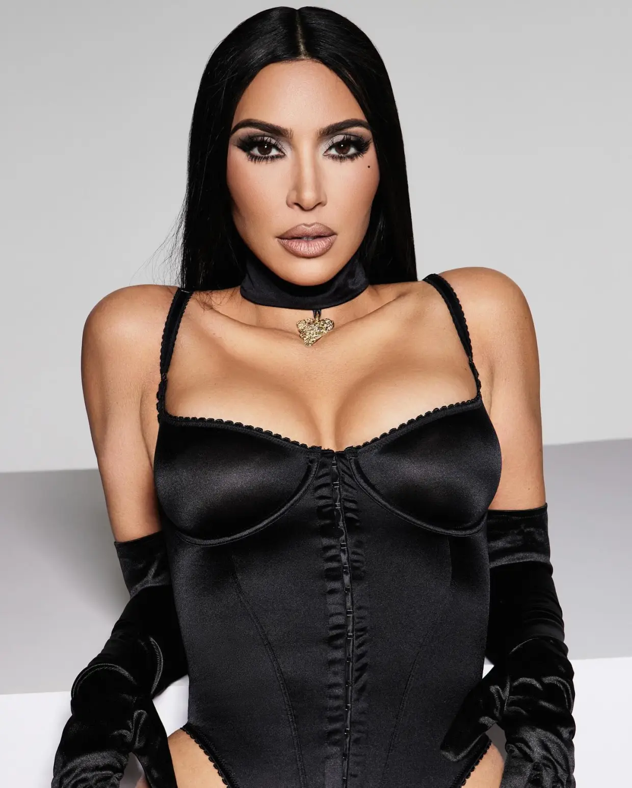 SATIN, BABY Kim Kardashian strips down to just black satin underwear and flaunts her shrinking curves as she promotes new Skims line