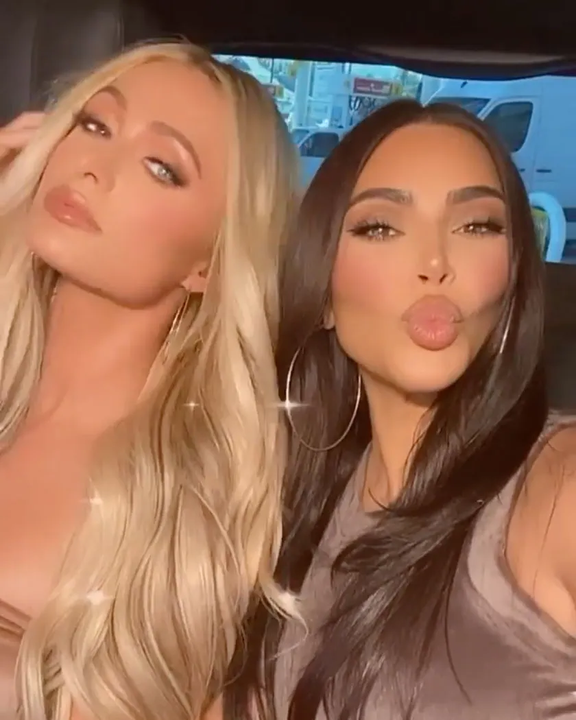 ‘SO FORCED’ Kim Kardashian fans ‘cringe’ at her ‘fake’ and ‘awkward’ exchange with Paris Hilton in fleeting moment at party