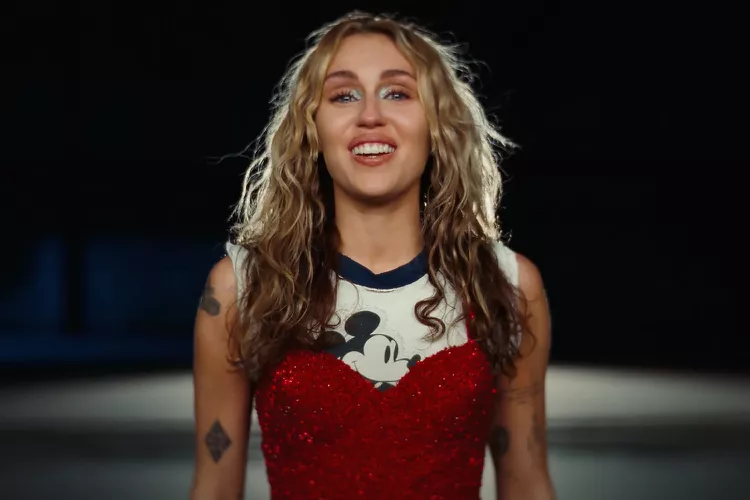 Miley Cyrus’ Mickey Mouse Shirt Pays Tribute to Her Disney Past in Emotional ‘Used to Be Young’ Video