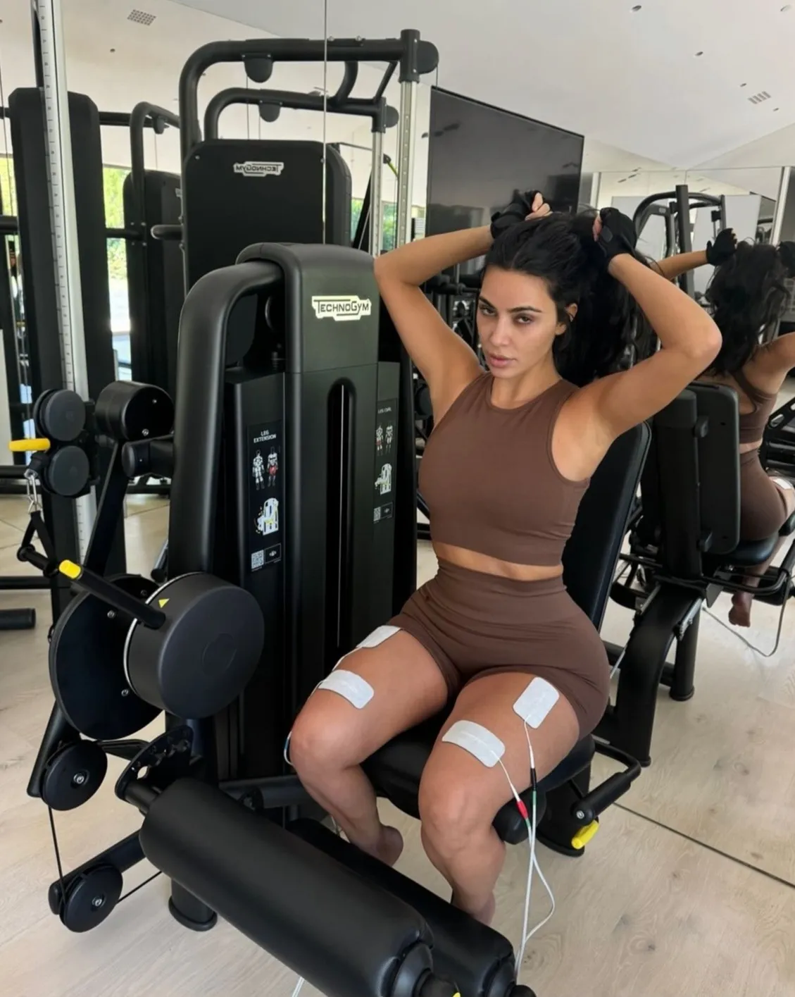 WORK IT Buy Kim Kardashian’s exact spandex shorts & crop top for ‘heavy weights’ workout as star boasts: ‘At least I look cute’