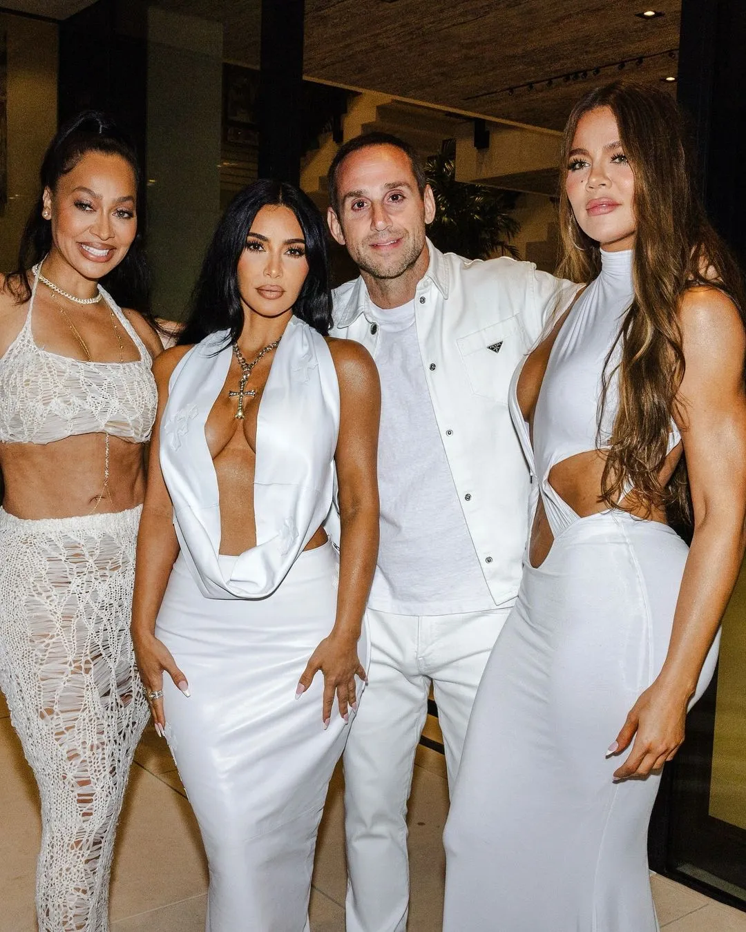 DARE TO BARE Kim Kardashian wears barely-there halter top for Mike Rubin’s Hamptons White Party with sister Khloe after feud